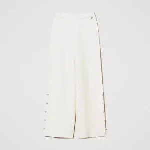 Pantaloni wide leg in maglia con perle